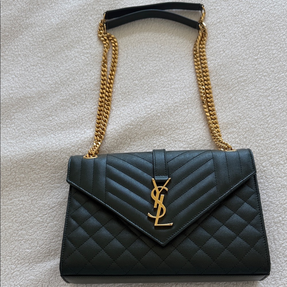 SAINT LAURENT
Envelope Triquilt Medium YSL Shoulder Bag in
Grained Leather